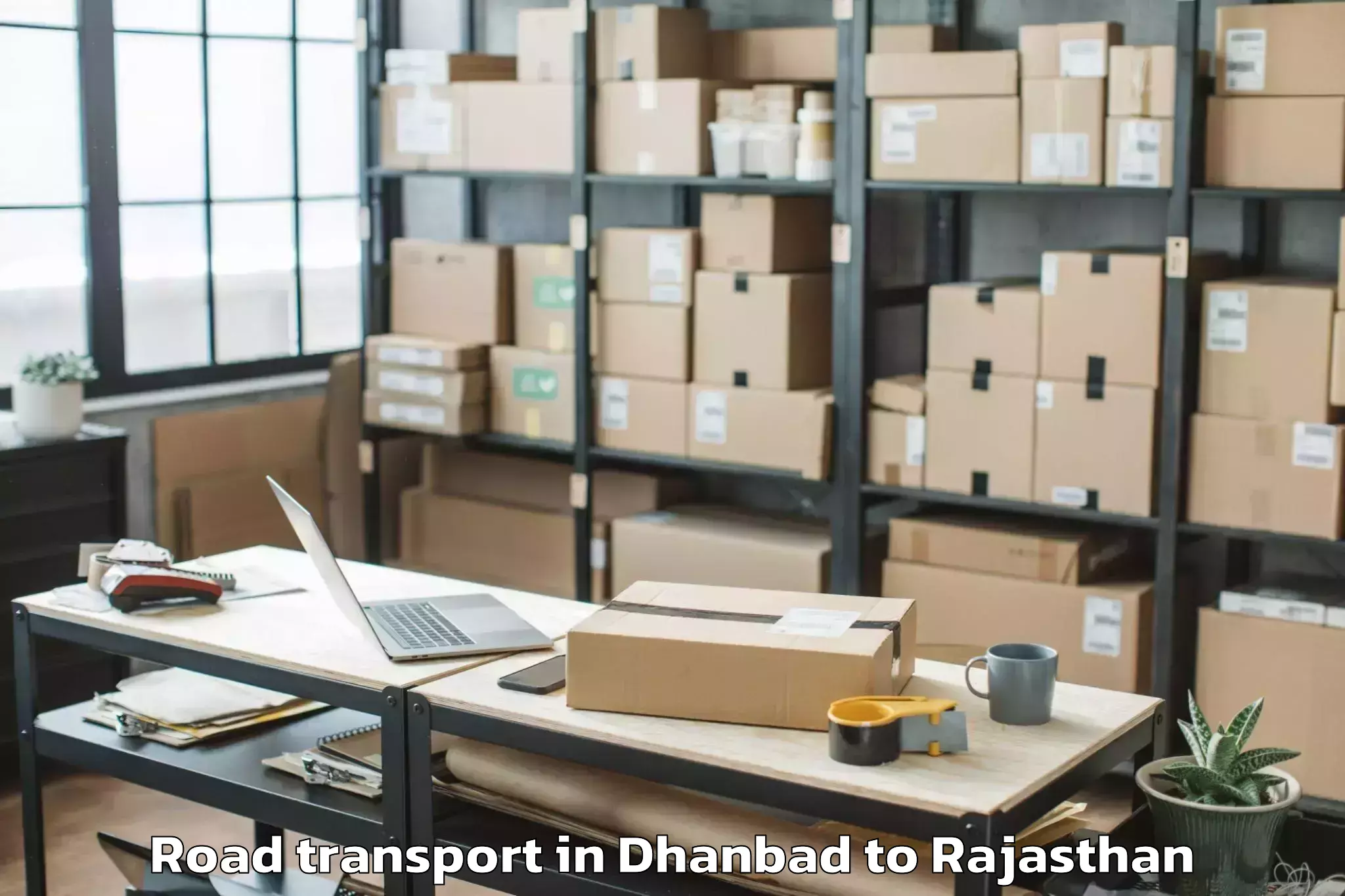 Top Dhanbad to Rajasthan University Of Health Road Transport Available